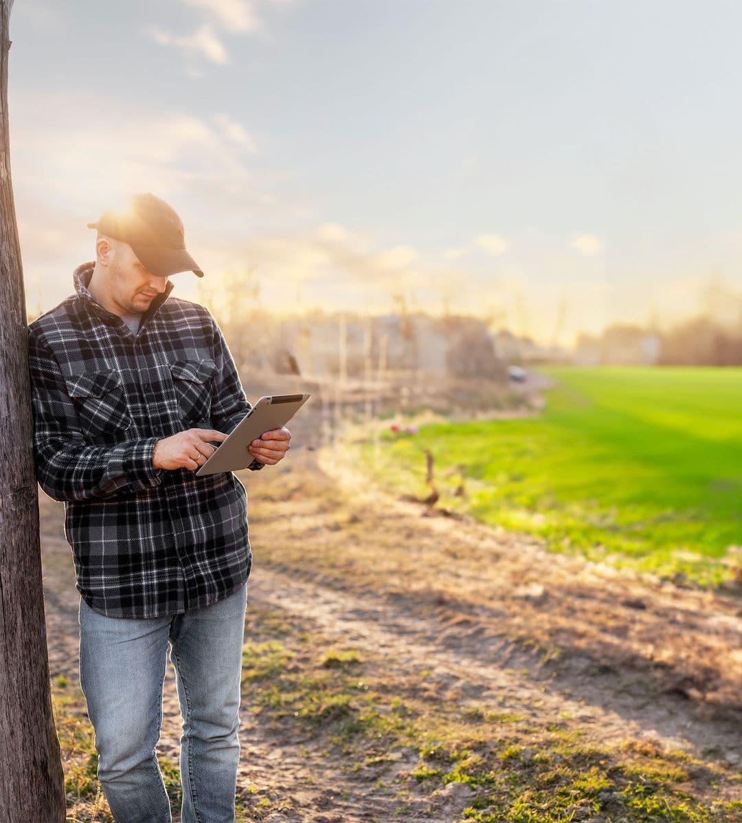 Farmer managing orders from tablet